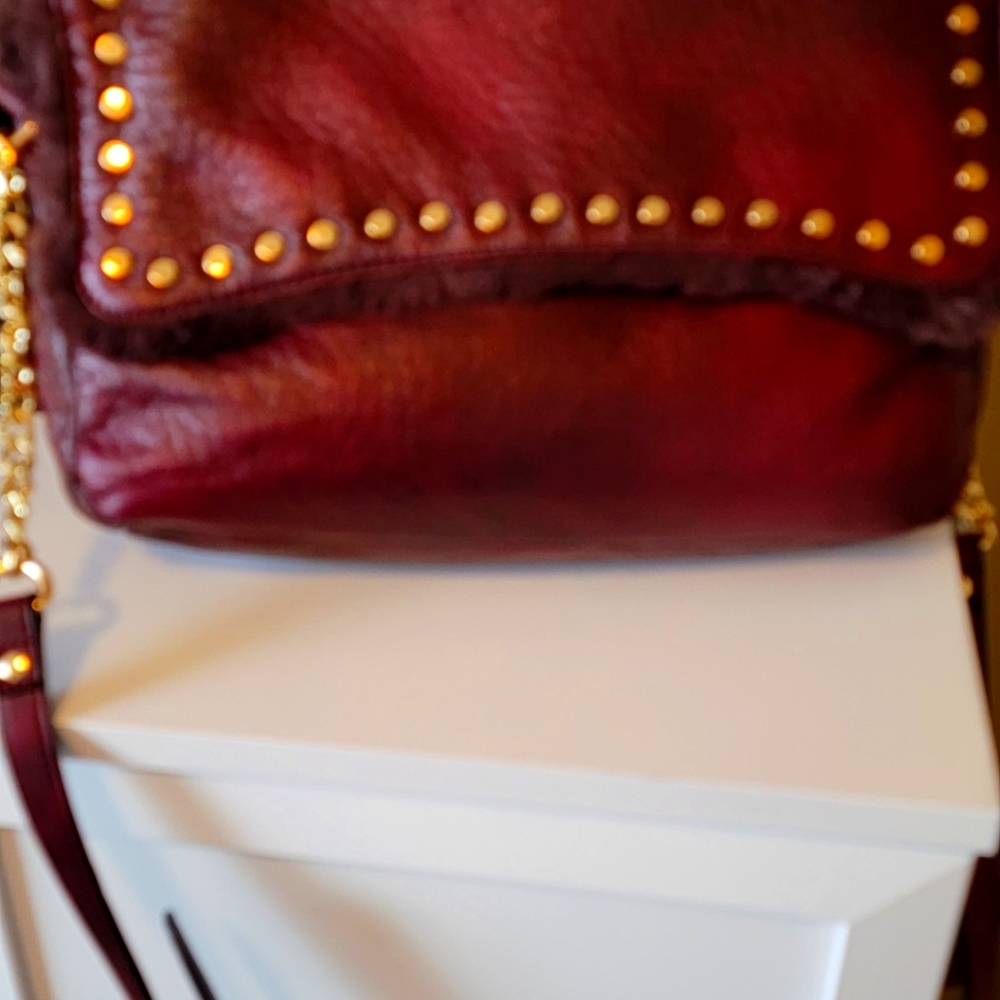 Large wine color reversible Hobo Urban Expressions Handbag.